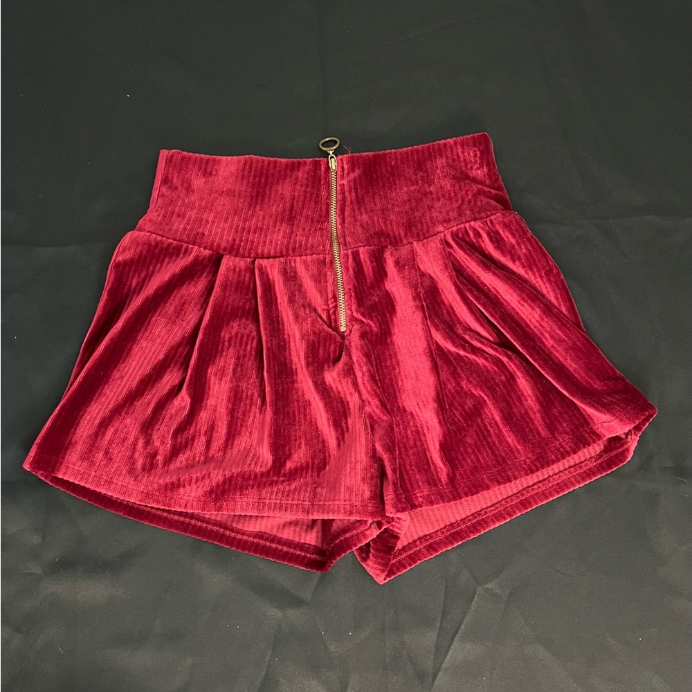 Maroon Shorts With a Zipper in the Front. Super soft and stretchy. Medium size.